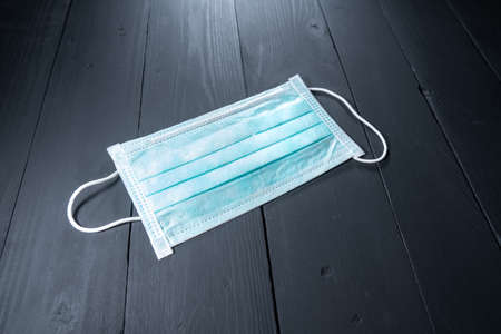 Medical face mask. Disposable surgical mask with rubber ear straps to cover the mouth and nose.の写真素材