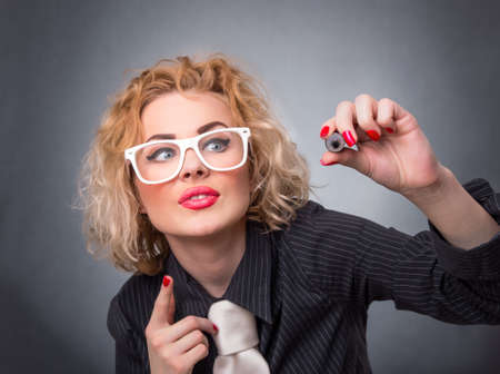Businesswoman is ready for drawing with pen, space for textの写真素材