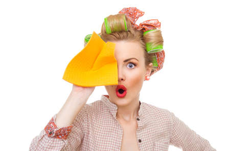 Funny young surprised housewife holding rag / wipe, isolated on white. Pin-up girlの写真素材