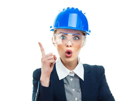 Astonished or surprised engineer woman, isolated on white background.Close-up of female contractor or entrepreneur, studio-shotの写真素材