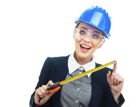 Surprised engineer woman with measure tape have an idea, isolated on white background.Close-up of female contractor or entrepreneur, studio-shotの写真素材