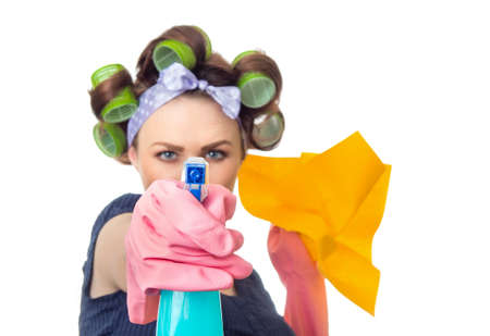 Woman with rag or wipe and cleaning spray for window. Close up of housewife, isolated on white...