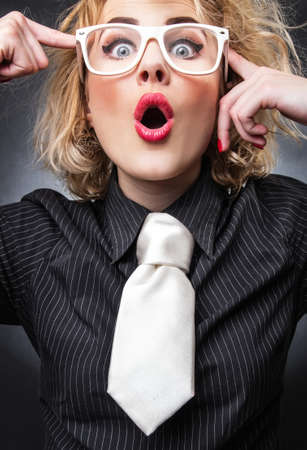 Portait of expressive young woman, formally funy woman, close-upの写真素材