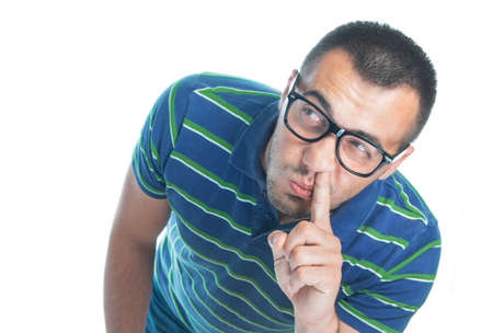 Funny confused man with finger in her nose thinking and looking up, isolated on white background, studio shot.の写真素材