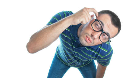 Above view of young man thinking. Worried guy, isolated on white background, studio shot.の写真素材