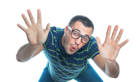 Funny guy showing his hands or palms, isolated on white background, studio shot.