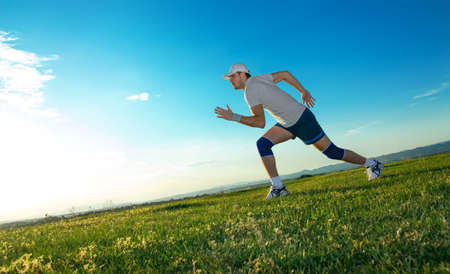 Active man ready for running, vitality runner on field
