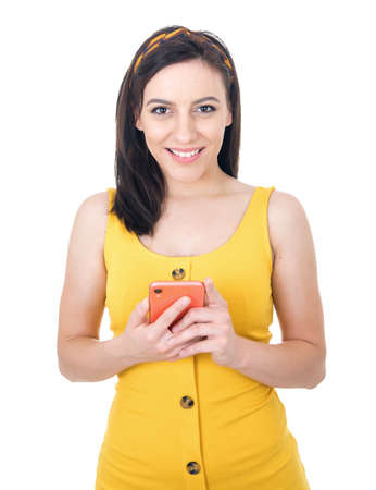 Beautiful happy woman with phone browsing, isolated on white background. Trendy woman browse. Studio shotの写真素材