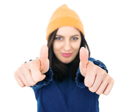 Young girl with thumbs up, like concept. Focus on fingers. Isolated on white background. Yes...