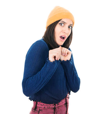 Afraid young woman popped eyes at camera, being terrible accident, isolated on white background. Studio shotの写真素材