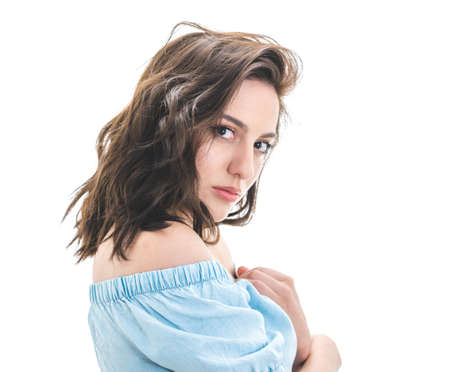 Portrait of young beautiful girl, isolated on white background. Close up brunette woman. Studio shotの写真素材