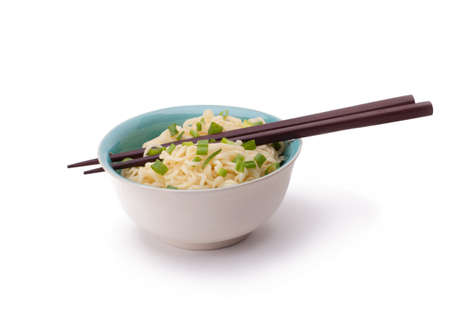 noodles  with  green onions in a bowl