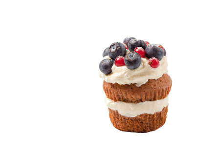 Tasty beautiful fruitcake with cream and berriesの写真素材