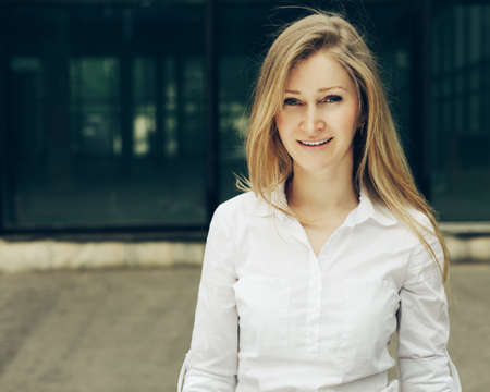 Stunning blond woman with blue eyes, portraitの写真素材