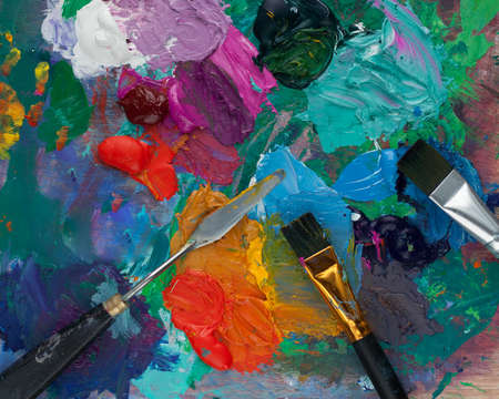 Top view, paint brush palette, different colors. The artist's tools for real art and inspiration. Dark lightの写真素材