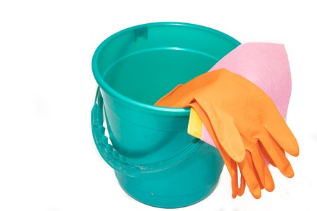 A bucket on a white background. The glove hangs on a plastic bucket. Plastic blue and green bucket on a white background. Bucket for washing floors.の写真素材