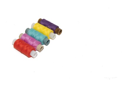 colored thread on white background. items for embroidery. handmade