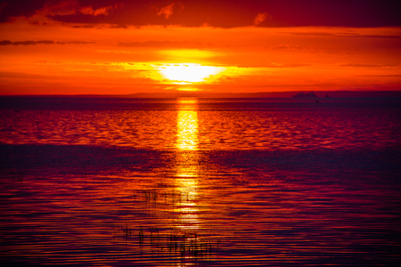 A bright sunset at the seaの写真素材