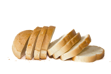 Baton in sliced on a white background. Baking from flour. White bread.の写真素材