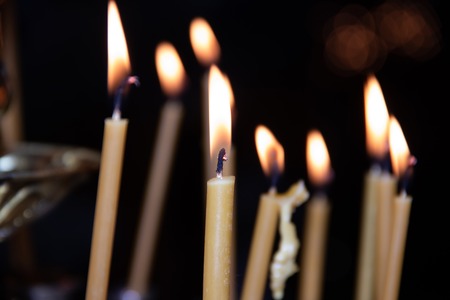 Candles in the temple. Religion and Orthodoxy in the Temples. Wax candles burn. The structure of the templeの写真素材