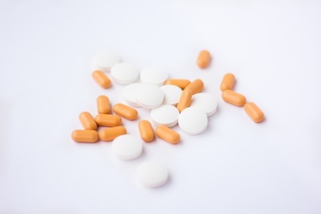 pills on white background. A cure for pain. Health and medicine. Chemical elements.