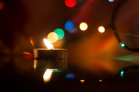 Wax candles burn in dark light. Wax candle. Burning fire Light from the fireの写真素材