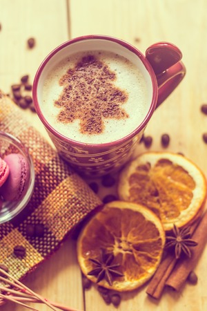 cup of coffee with a new year pattern. Christmas tree made of cinnamon in a cup with coffee. good New Year spirit. New Year's and Christmas. Celebration.の写真素材