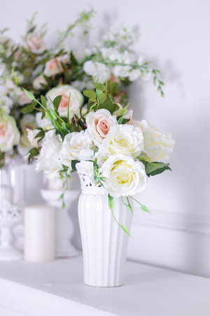 Wedding bouquet of white roses in a vase. Wedding decorations. White Rose. Wedding Attributesの写真素材
