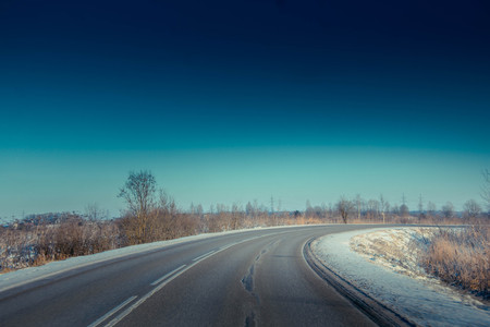 winter snowy road. snow lies near the road. winter picture