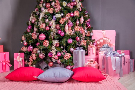 Pink Christmas balls on the Christmas tree. Christmas tree decoration. New Year's and Christmasの写真素材