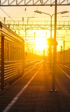 railway at sunset public transport. transportation of people and freight. travel around cities and...