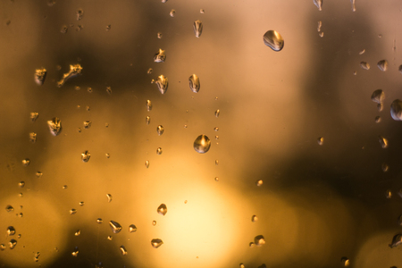 water drops on the glass. Texture of a drop of water. Bad mood. Water and rainの写真素材