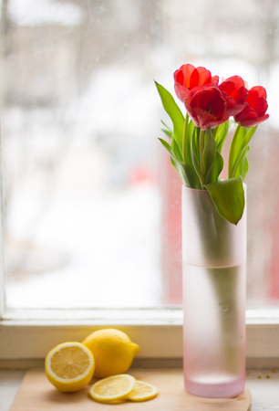 Red tulips in a vase. Postcard to the international women's day. March 8.の写真素材
