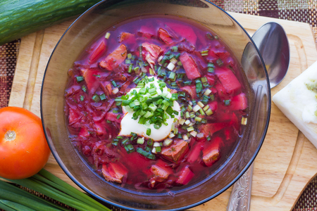 Borsch with sour cream and greens. Dinner. Red soup. Proper healthy eating. Food and Drink