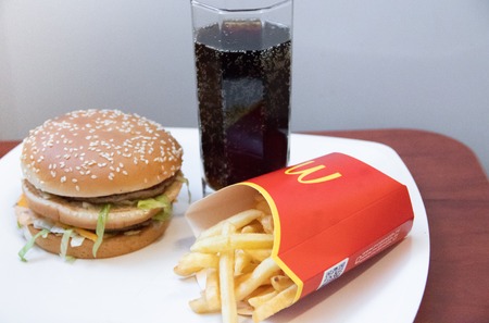 Big Mac and French Fries from McDonalds in Russia. Unhealthy food. Cholesterol and obesity. Russia, St. Petersburg, January 22, 2019: Hamburger menu at McDonald's French Fries, Big Mac. Fast food conceptのeditorial素材