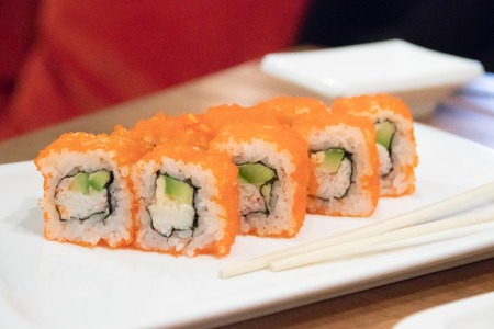 Rolls on a white plate in a restaurant. Food from fish. Japanese food. Restaurant beautiful dishes. Food and Drinkの写真素材