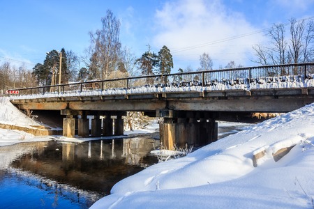 Spring landscape on the river. Ice is melting on the river. Sunny march day. Country nature. Proiroda outside the city. Russian province.の写真素材