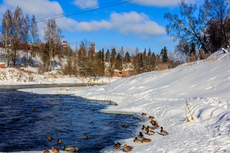 Spring landscape on the river. Ice is melting on the river. Sunny march day. Country nature. Proiroda outside the city. Russian province.の写真素材