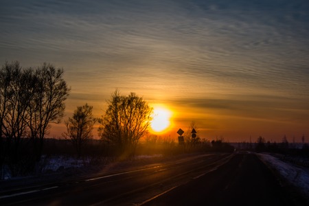 sunset and road. road outside the city. Russian roads in the outbackの写真素材