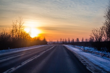 sunset and road. road outside the city. Russian roads in the outbackの写真素材