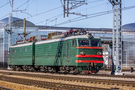 Electric locomotive on the railway. Locomotive rides by rail. Station Lyuban, Russia, Leningrad Region April 7, 2018のeditorial素材