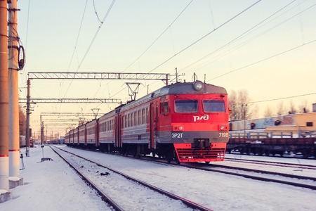 Train on the platform. Electric train on the railway. Russian railway. Platform Preportovaya, Russia, St. Petersburg, March 5, 2018のeditorial素材