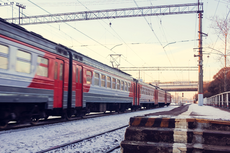 Train on the platform. Electric train on the railway. Russian railway. Platform Preportovaya, Russia, St. Petersburg, March 5, 2018のeditorial素材