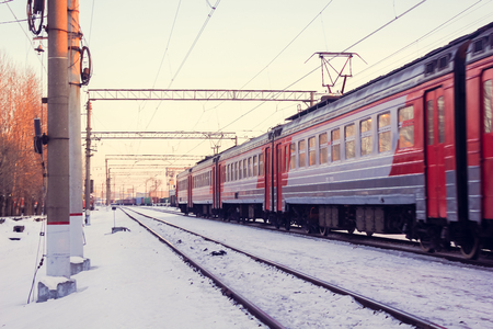 Train on the platform. Electric train on the railway. Russian railway. Platform Preportovaya, Russia, St. Petersburg, March 5, 2018のeditorial素材