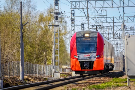 . Russian electric train on rails . The railways of Russia, Russia, Leningrad region, Pargolovo station, May 8, 2018, a tour of the cities and villages spring-summerのeditorial素材
