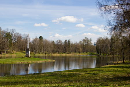 Sunny spring park urban. Warms in the park. Foliage blooms and the grass turns green. Russian park. May.の写真素材