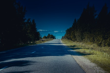 Russian asphalt road out of town. Travelling by car. Road views