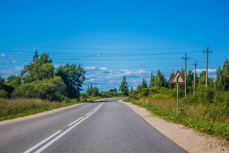 Russian asphalt road out of town. Travelling by car. Road viewsの写真素材