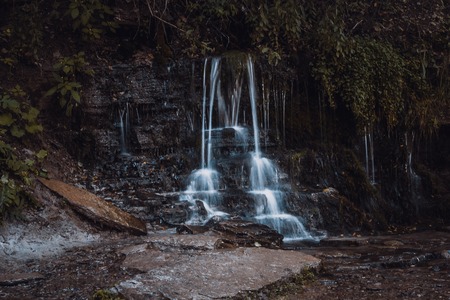 A small waterfall. Waterfalls in the outback of Russia. Water flows down. Water flowの写真素材