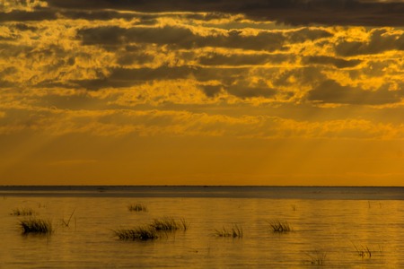 Unusual sunset on the sea. Sea sunset background. Evening sunset Sea and sky. Beautiful sunset. Fiery sky Sky and clouds.の写真素材
